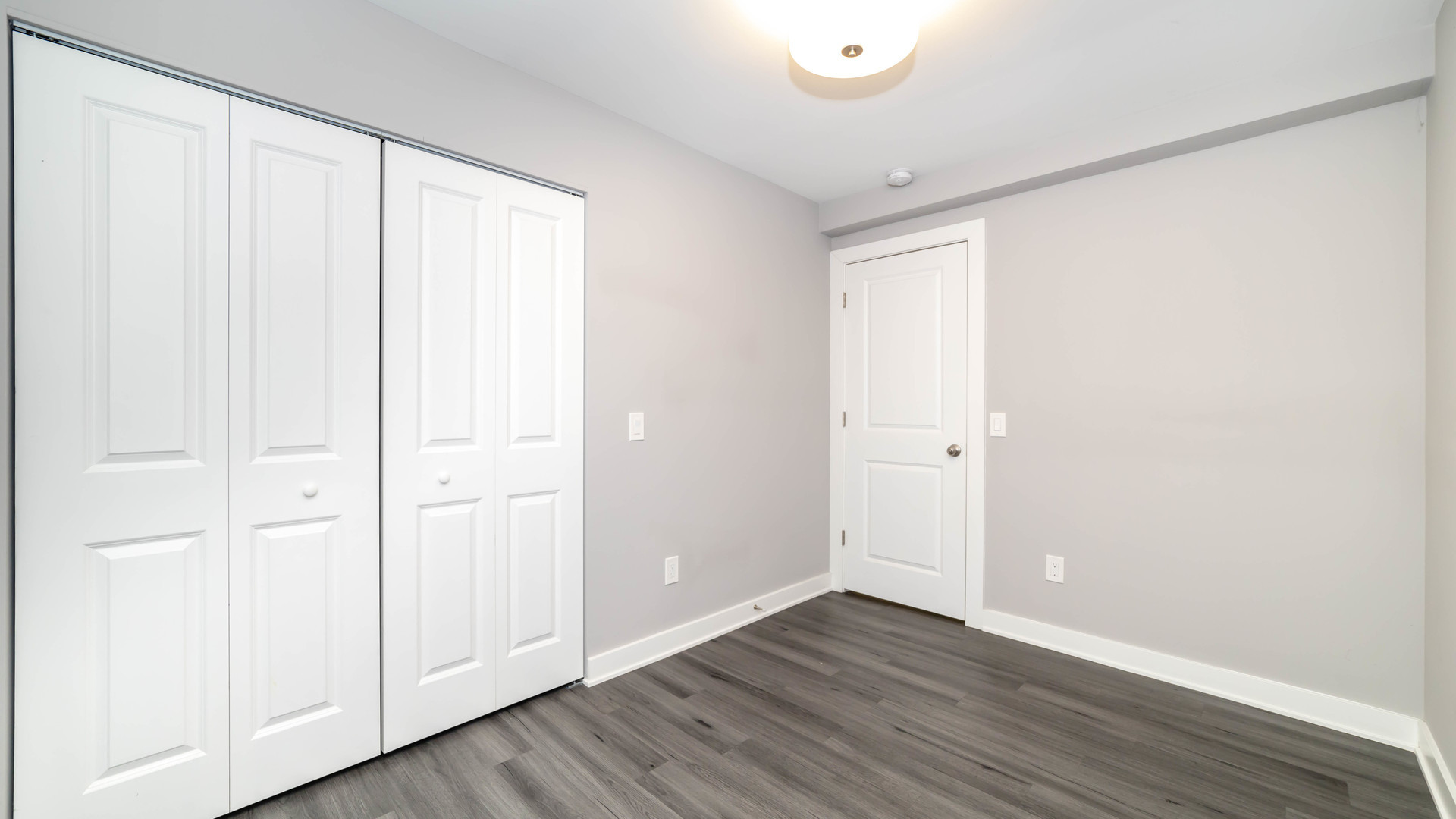 2246 South Whipple Street, Unit 2F Chicago, IL 60623 - Photo 5 of 10 a view of an empty room with wooden floor