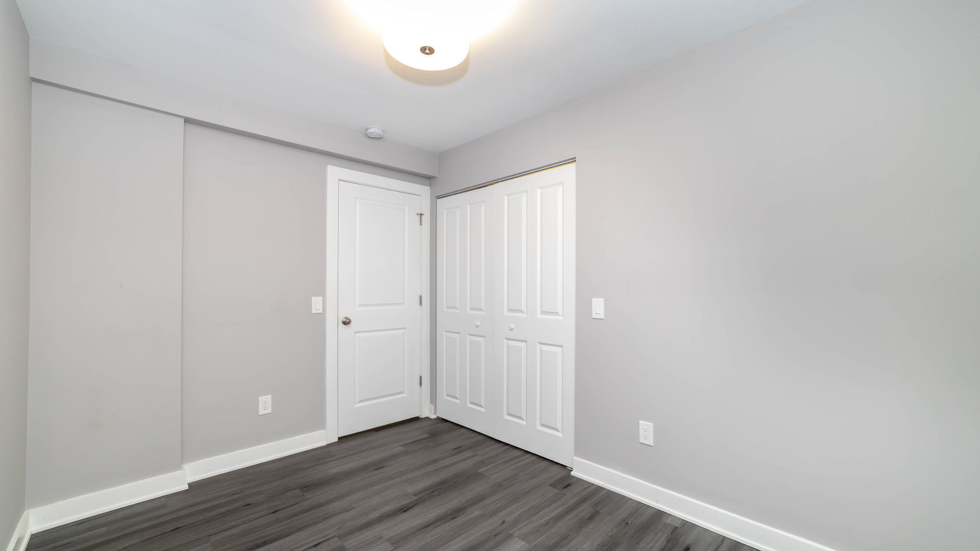 2246 South Whipple Street, Unit 2F Chicago, IL 60623 - Photo 7 of 10 a view of an empty room with wooden floor