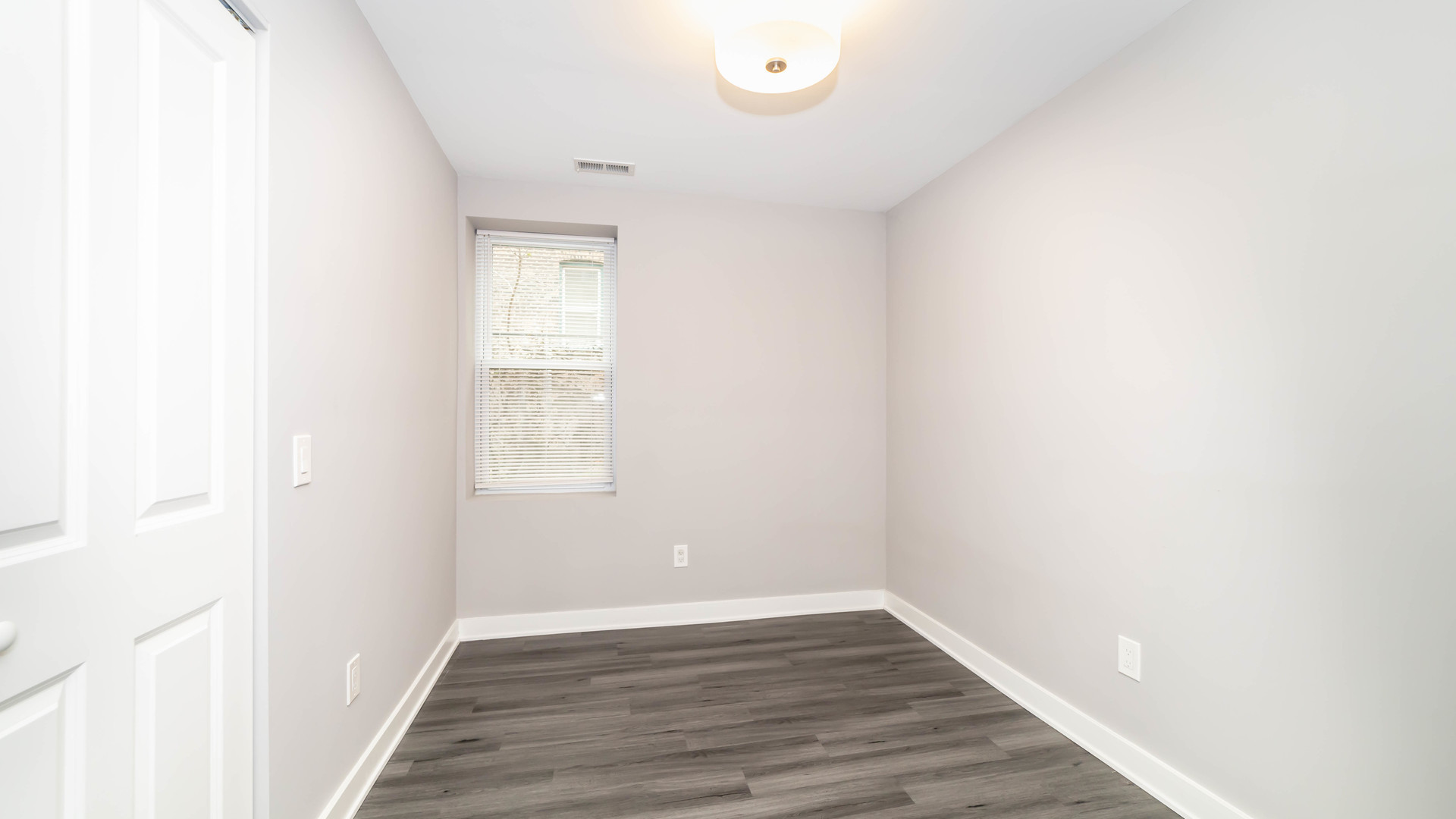 2246 South Whipple Street, Unit 2F Chicago, IL 60623 - Photo 8 of 10 a view of an empty room with wooden floor