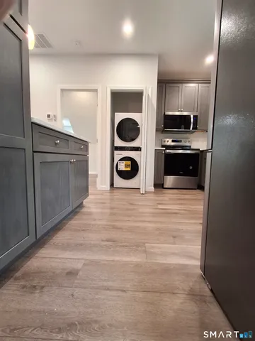 a kitchen with stainless steel appliances granite countertop a stove and a microwave