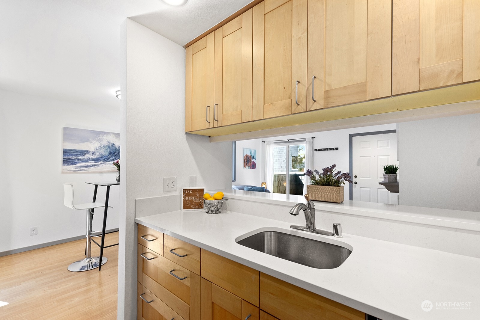 4118 58th Place Southwest, Unit 2 Seattle, WA 98116 - Photo 11 of 23 a kitchen with a sink and cabinets