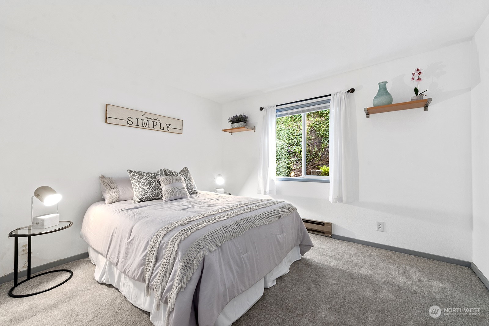 4118 58th Place Southwest, Unit 2 Seattle, WA 98116 - Photo 13 of 23 a bedroom with a bed and a window