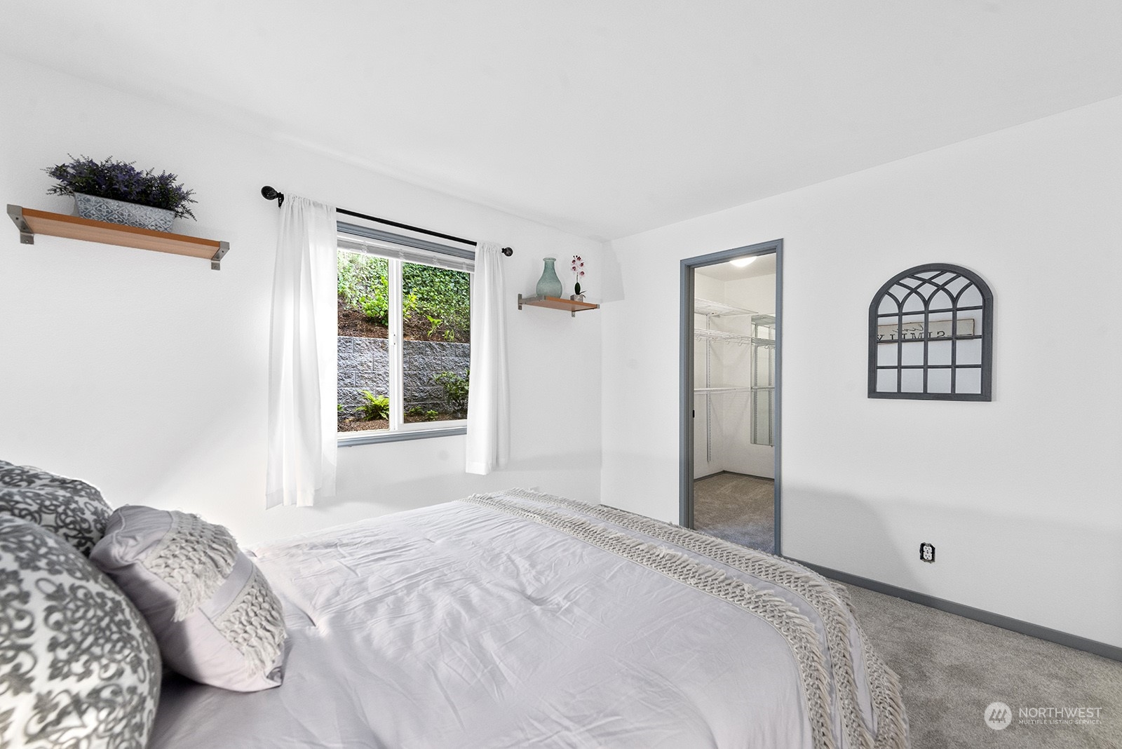 4118 58th Place Southwest, Unit 2 Seattle, WA 98116 - Photo 14 of 23 a bedroom with a bed and a window