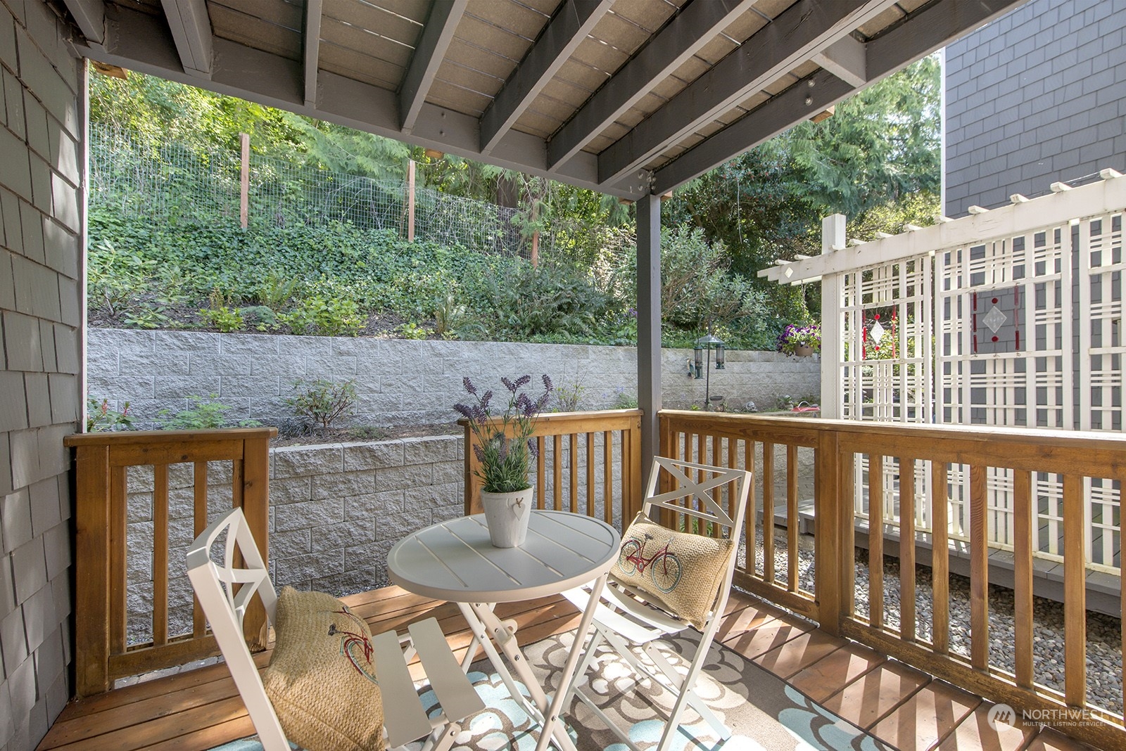 4118 58th Place Southwest, Unit 2 Seattle, WA 98116 - Photo 18 of 23 a view of balcony with furniture and garden
