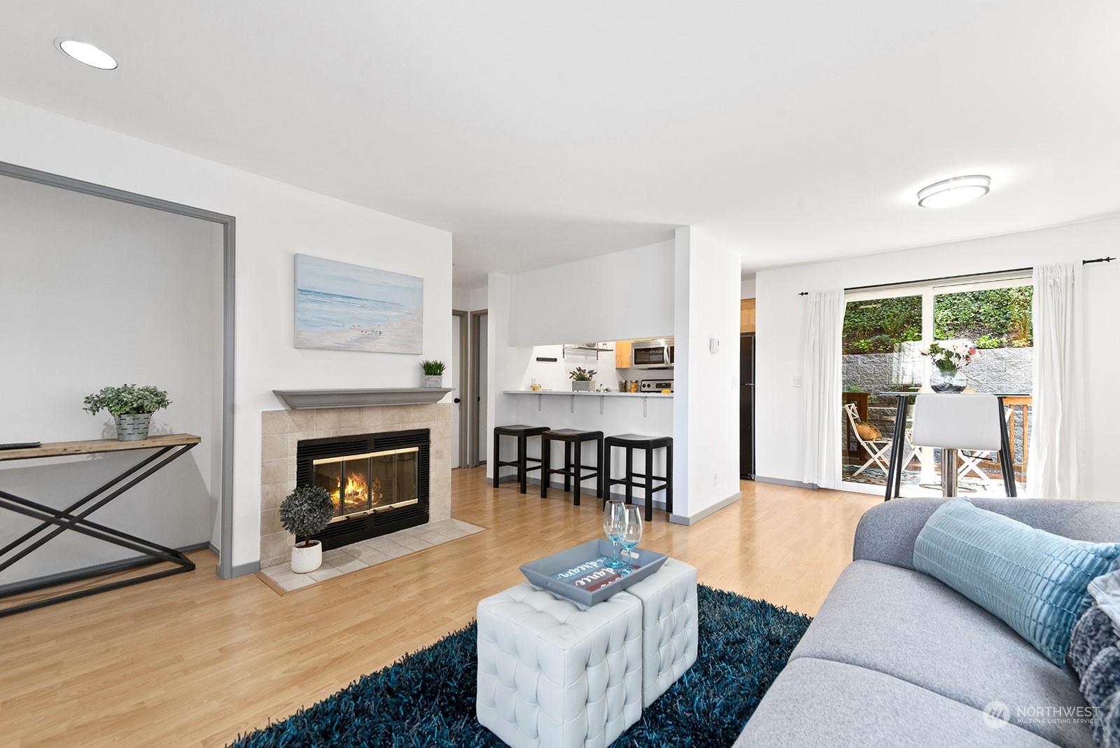 4118 58th Place Southwest, Unit 2 Seattle, WA 98116 - Photo 5 of 23 a living room with furniture and a fireplace