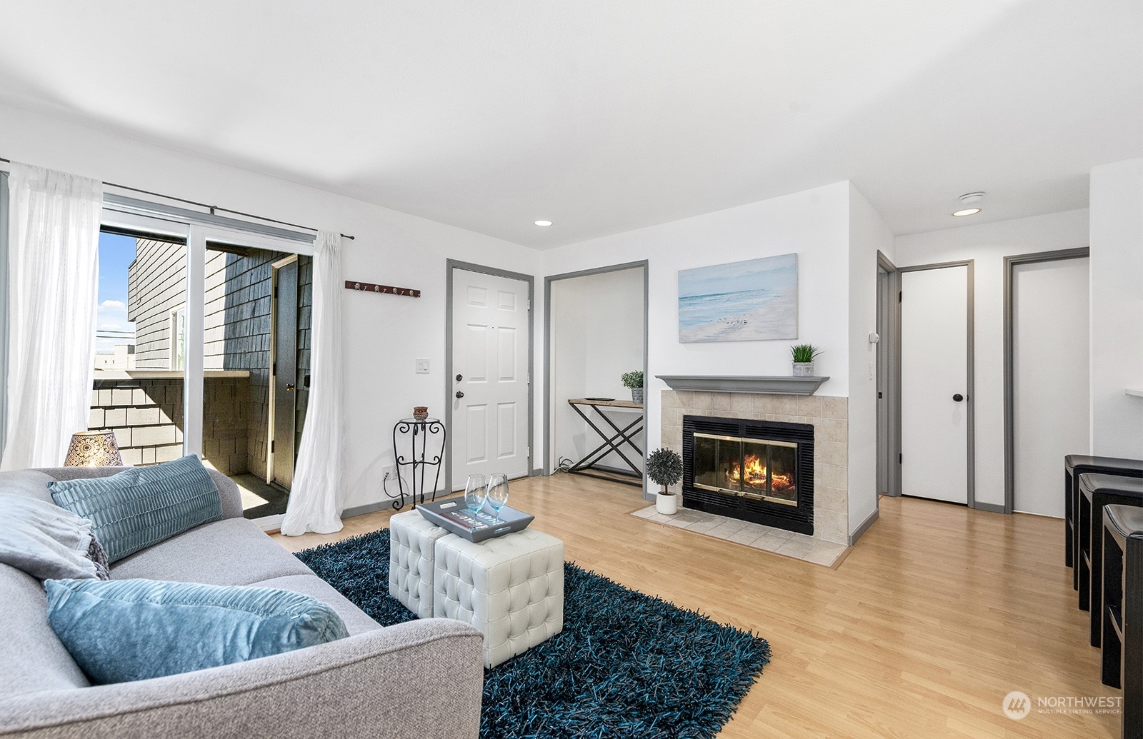 4118 58th Place Southwest, Unit 2 Seattle, WA 98116 - Photo 6 of 23 a living room with furniture and a fireplace