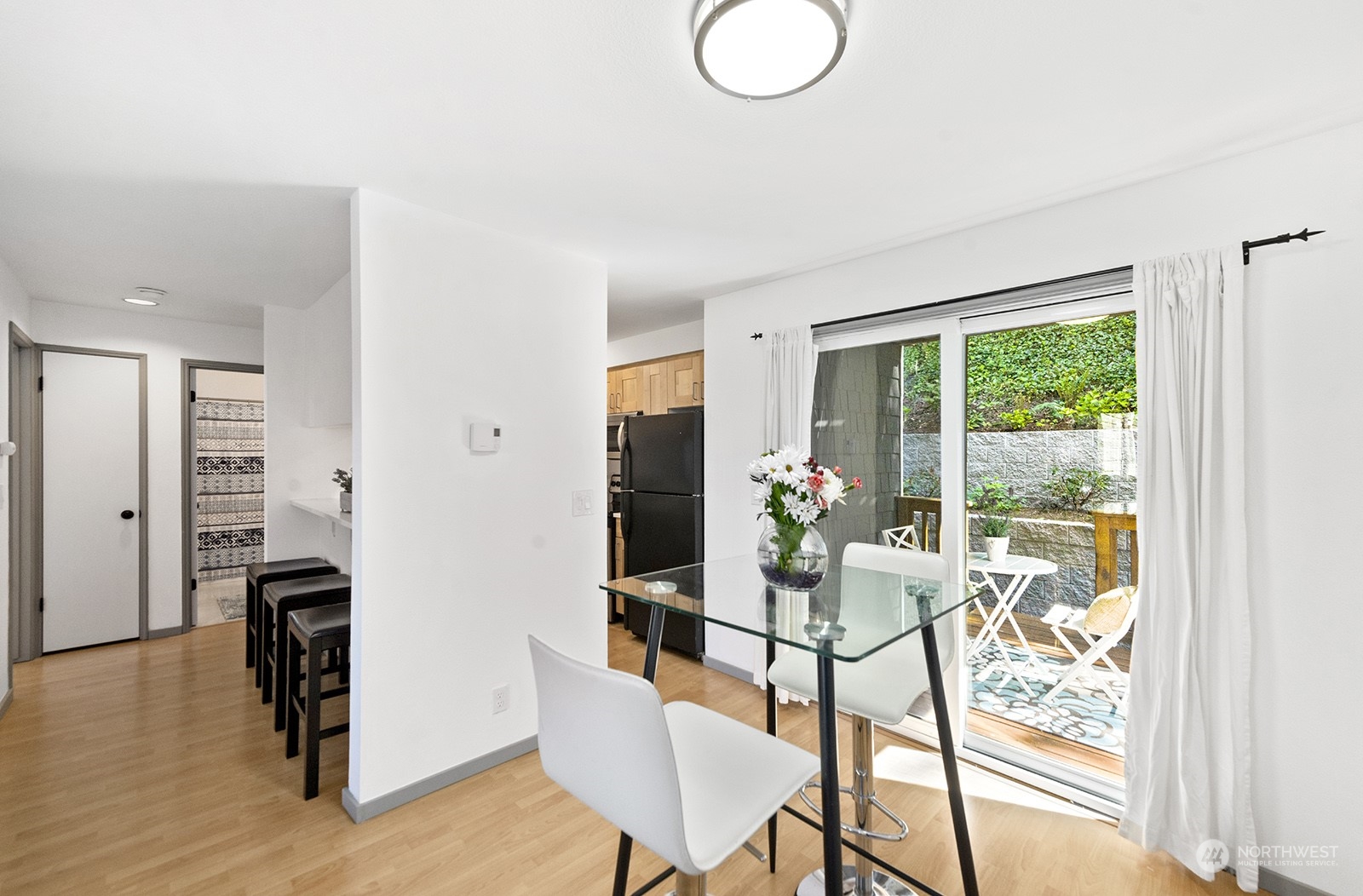4118 58th Place Southwest, Unit 2 Seattle, WA 98116 - Photo 9 of 23 a living room with furniture and a large window