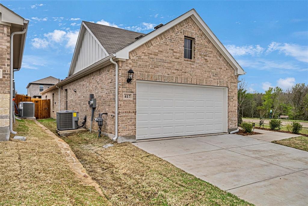 417 Martell Road Lowry Crossing, TX 75069 - Photo 3 of 29 a front view of a house with a yard