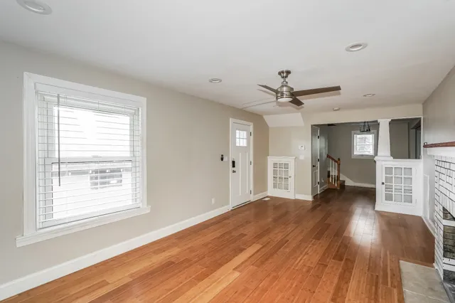 a view of livingroom with hardwood floor and ceiling fan