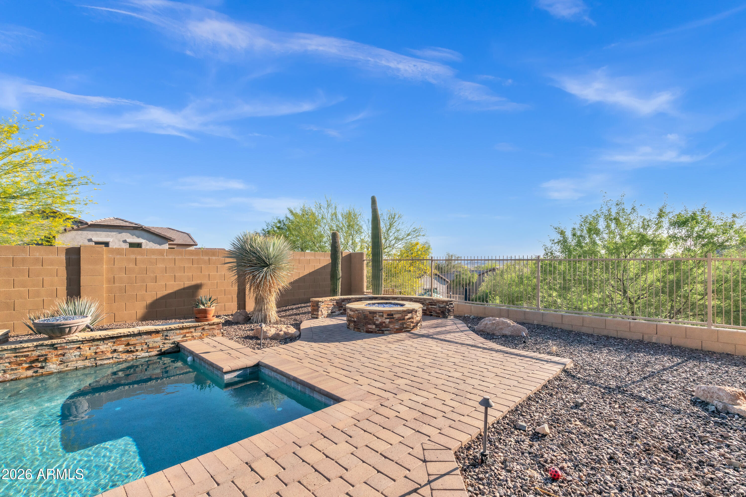 1615 West Red Fox Road Phoenix, AZ 85085 - Photo 55 of 64 a view of a swimming pool with a lounge chairs