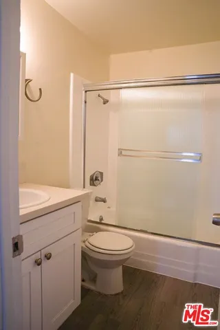 a bathroom with a toilet a sink and a shower