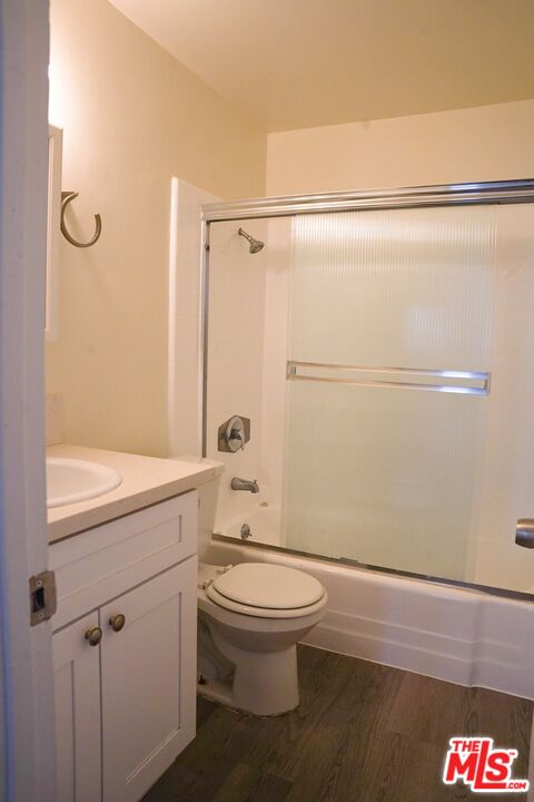 18444 Collins Street, Unit 14 Tarzana, CA 91356 - Photo 11 of 18 a bathroom with a toilet a sink and a shower