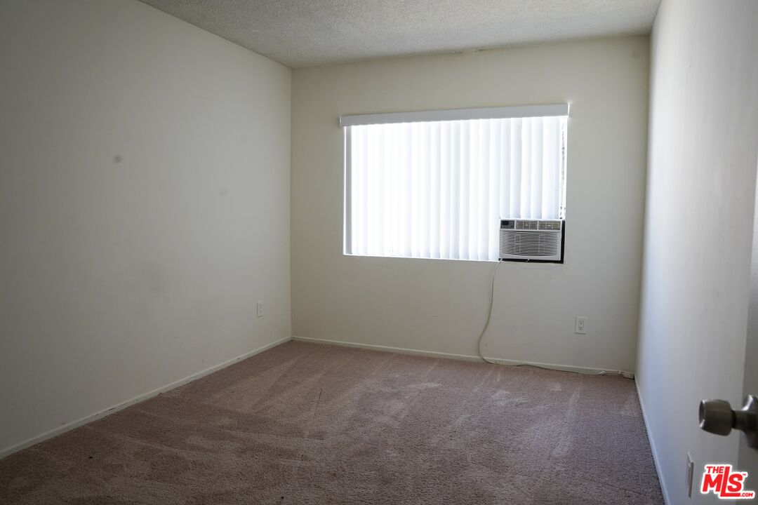 18444 Collins Street, Unit 14 Tarzana, CA 91356 - Photo 18 of 18 an empty room with a window