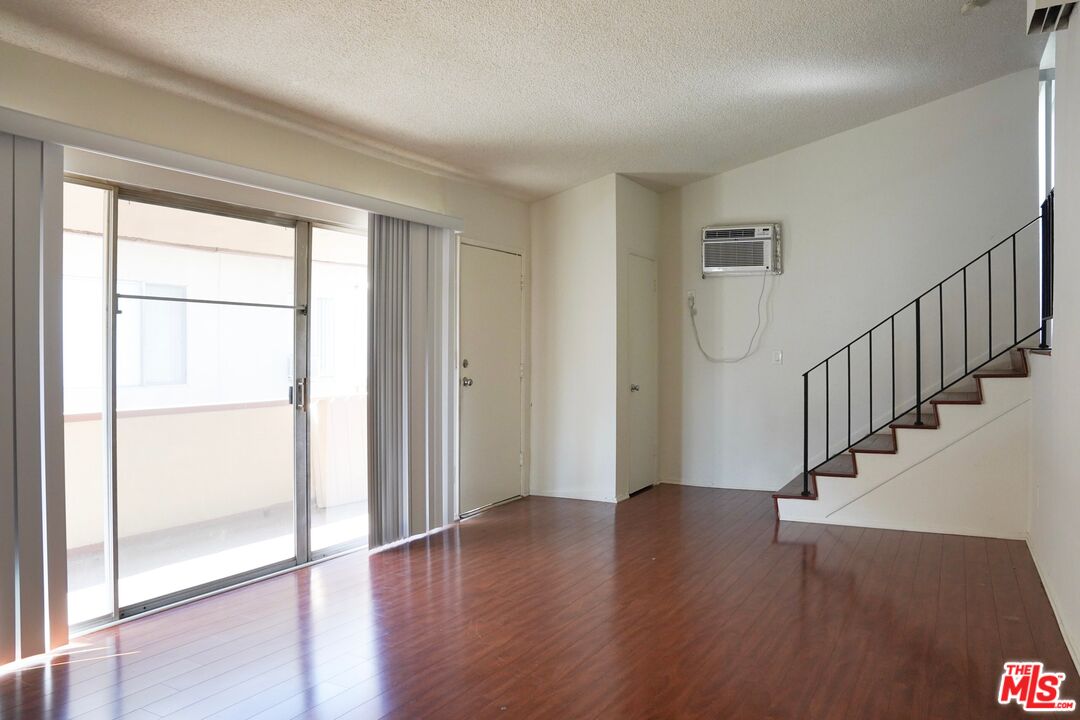 18444 Collins Street, Unit 14 Tarzana, CA 91356 - Photo 5 of 18 a view of entryway with wooden floor