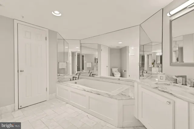a bathroom with a double vanity sink mirror and double