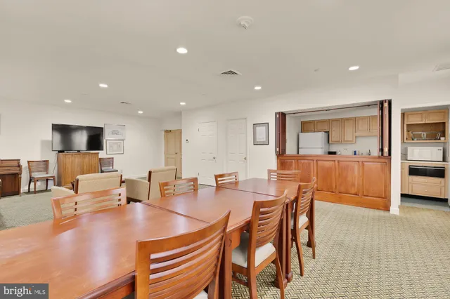 a view of a a dining room with furniture window and outside view