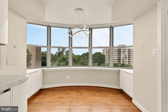 a kitchen with stainless steel appliances granite countertop a sink and a stove