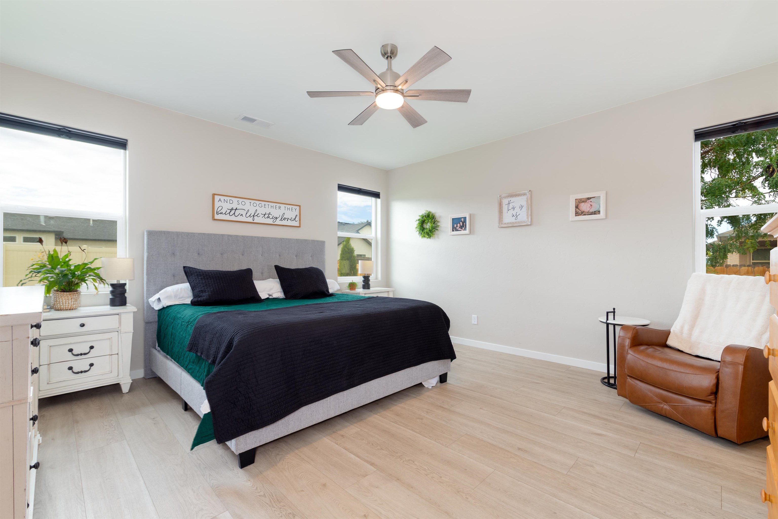 1518 Myers Lane Fruita, CO 81521 - Photo 12 of 39 a bedroom with a bed and ceiling fan