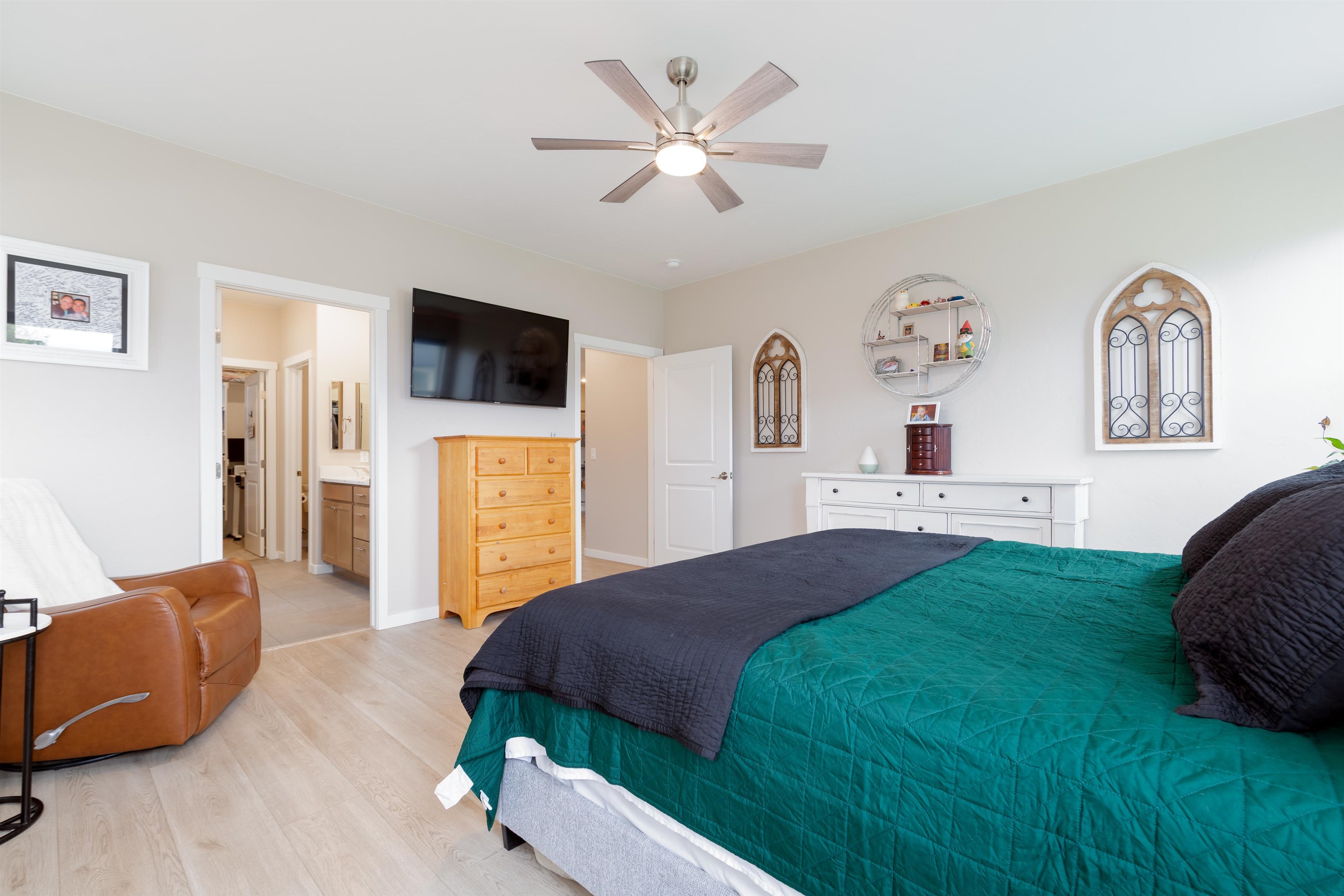 1518 Myers Lane Fruita, CO 81521 - Photo 13 of 39 a spacious bedroom with a bed and a television
