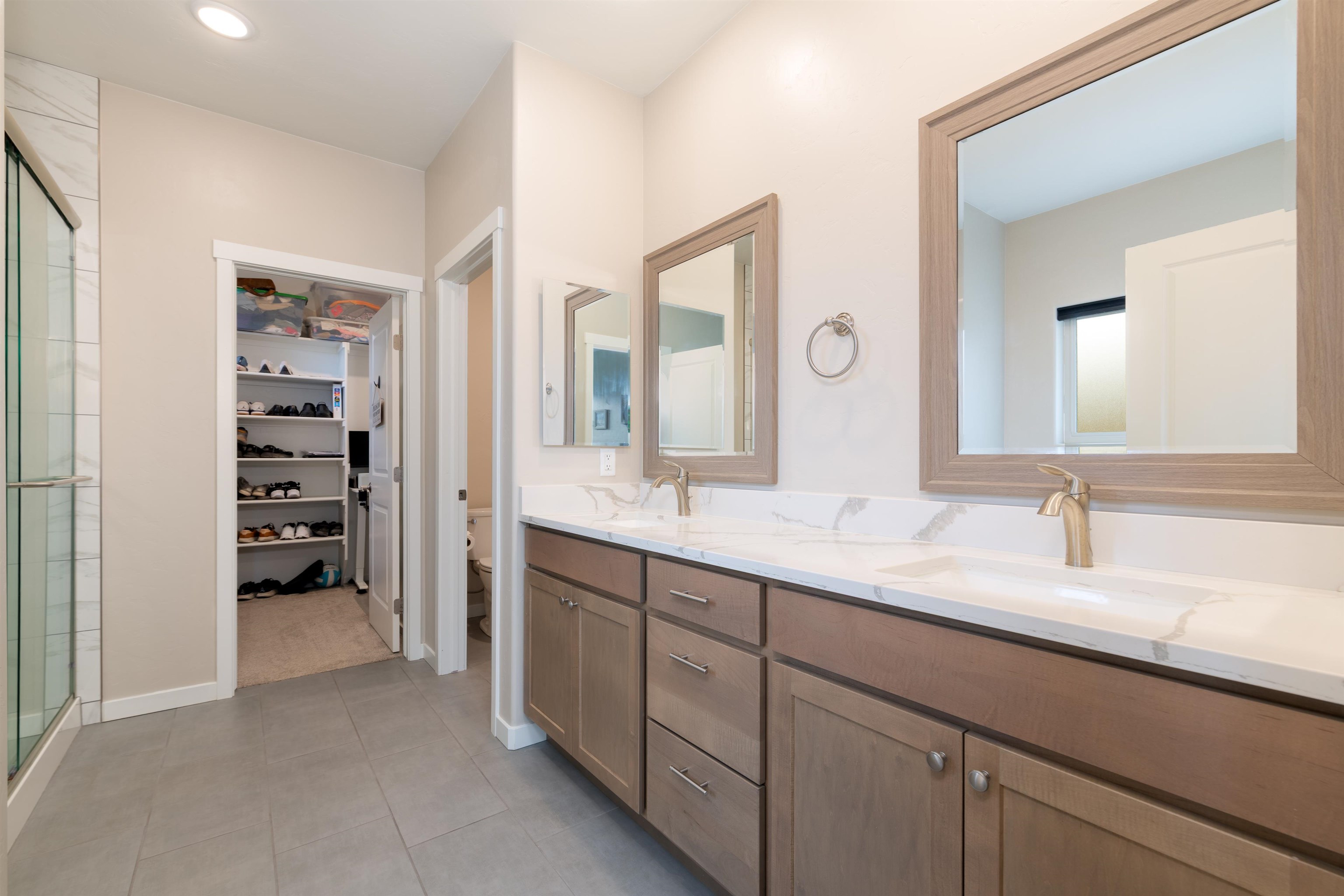 1518 Myers Lane Fruita, CO 81521 - Photo 14 of 39 a spacious bathroom with a double vanity sink a and a mirror