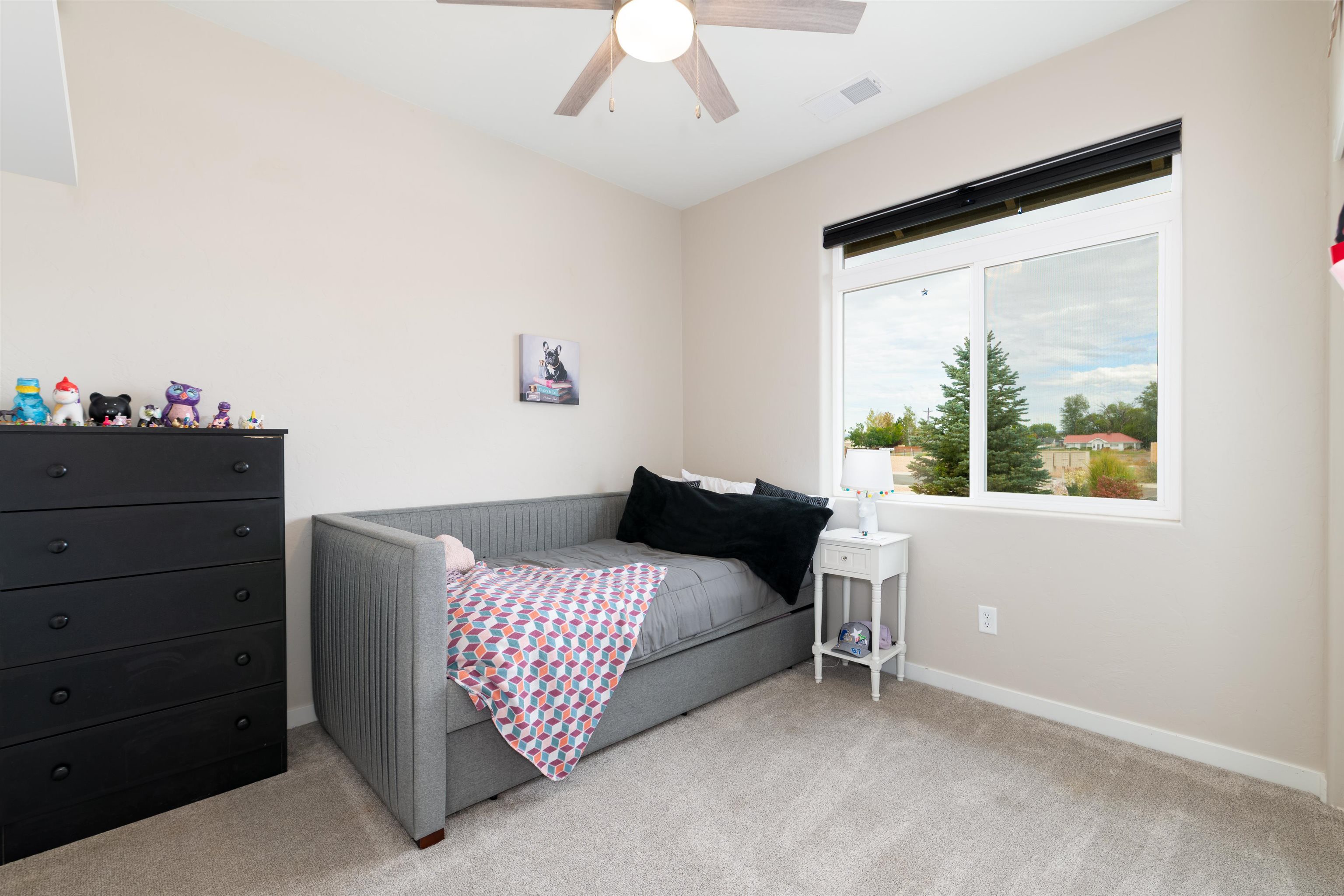 1518 Myers Lane Fruita, CO 81521 - Photo 16 of 39 a bedroom with a bed and a window