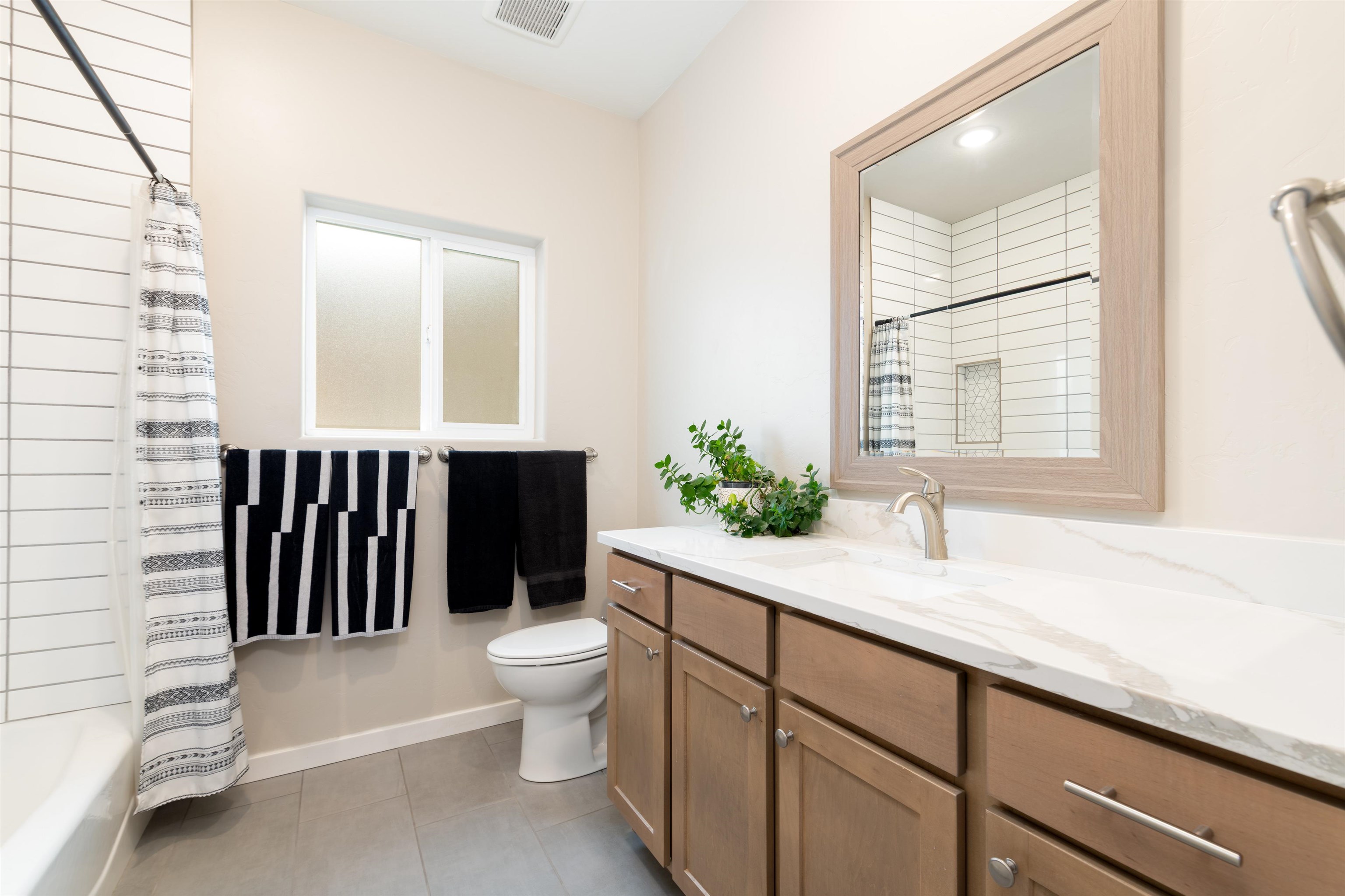 1518 Myers Lane Fruita, CO 81521 - Photo 17 of 39 a bathroom with a granite countertop sink vanity mirror and toilet