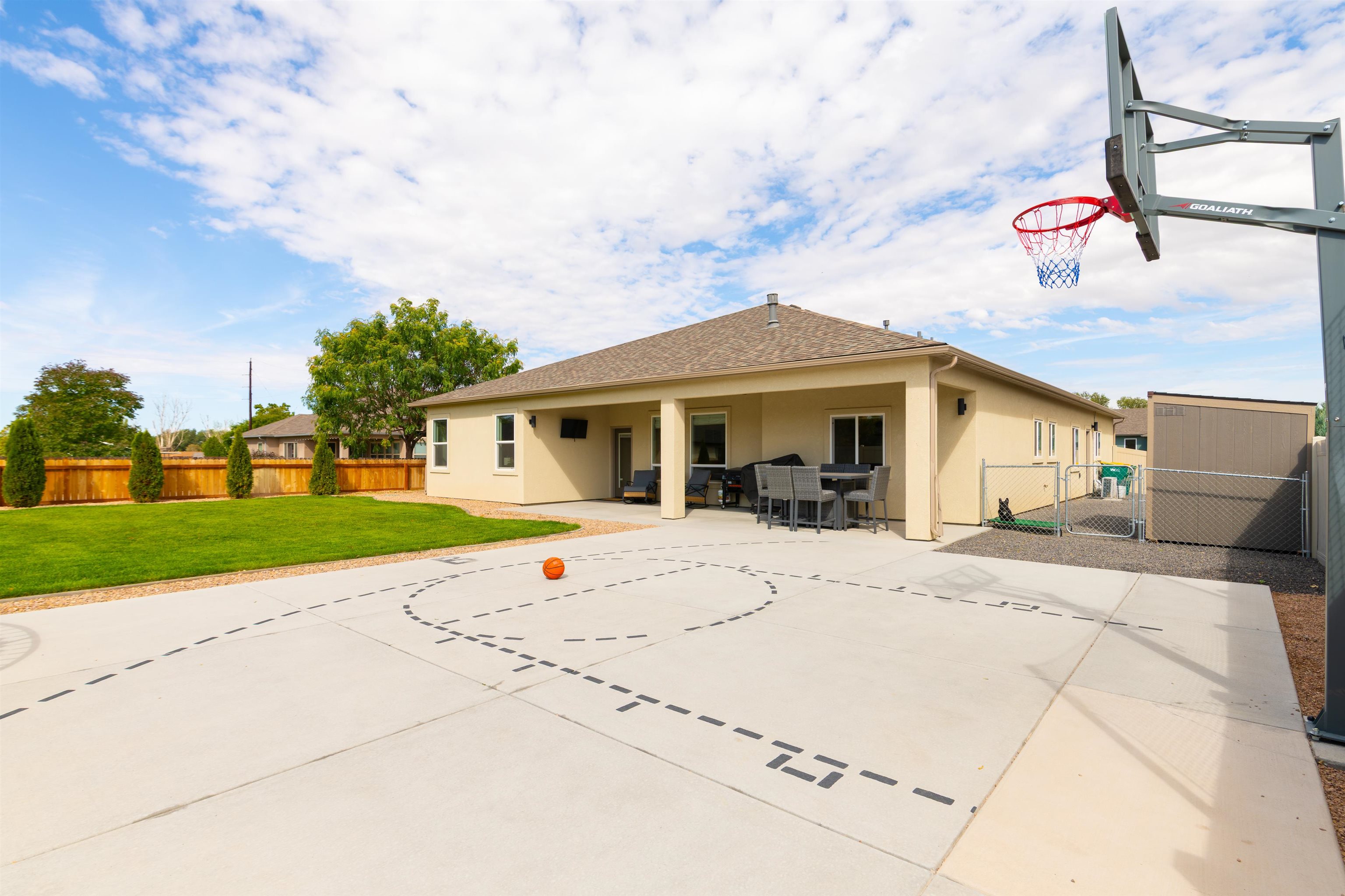 1518 Myers Lane Fruita, CO 81521 - Photo 27 of 39 a front view of a house with a yard and potted plants