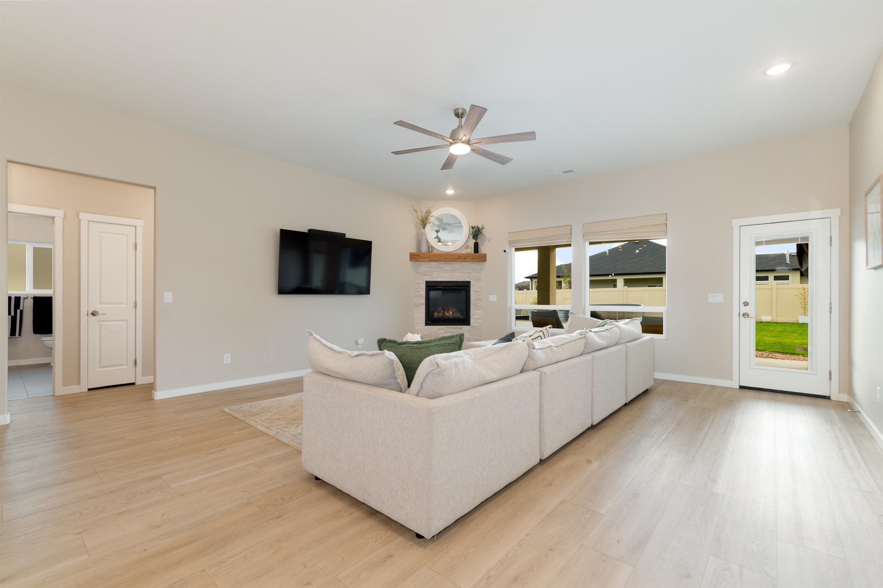1518 Myers Lane Fruita, CO 81521 - Photo 3 of 39 a living room with furniture fireplace and a flat screen tv