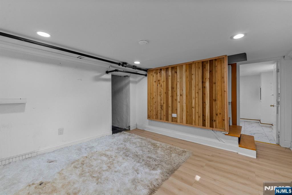 193 Fort Lee Road Teaneck, NJ 07666 - Photo 12 of 13 a view of an empty room with wooden floor