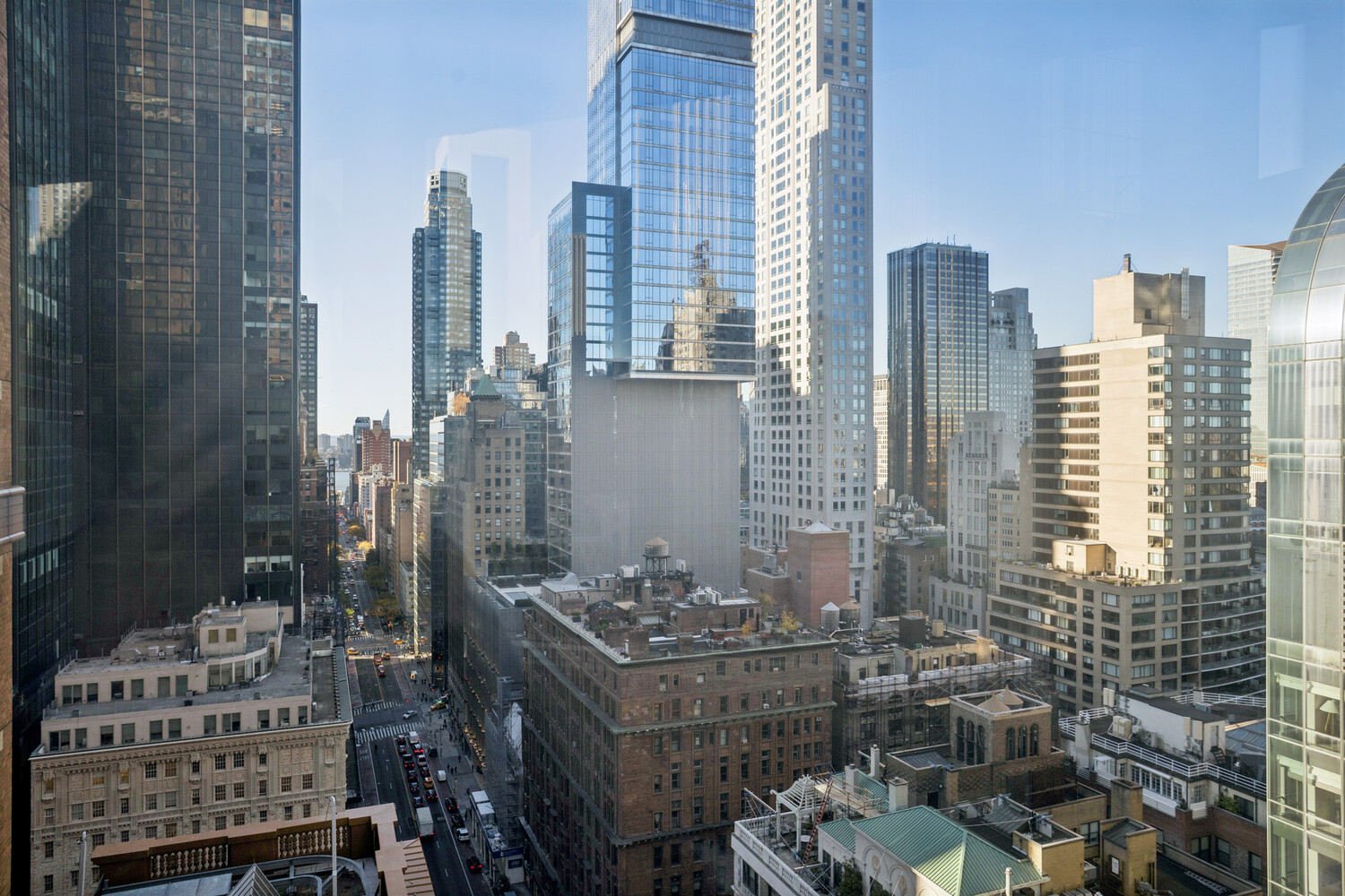 146 West 57th Street, Unit 34A Manhattan, NY 10019 - Photo 10 of 15 a view of a city with tall buildings