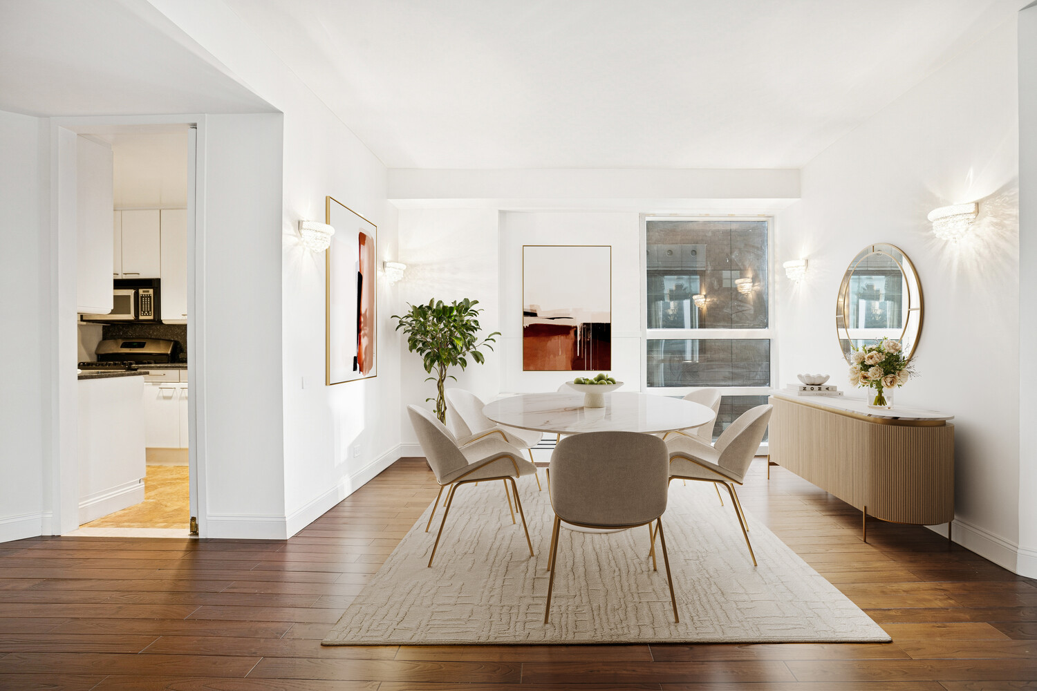 146 West 57th Street, Unit 34A Manhattan, NY 10019 - Photo 3 of 15 a view of a dining room with furniture and wooden floor