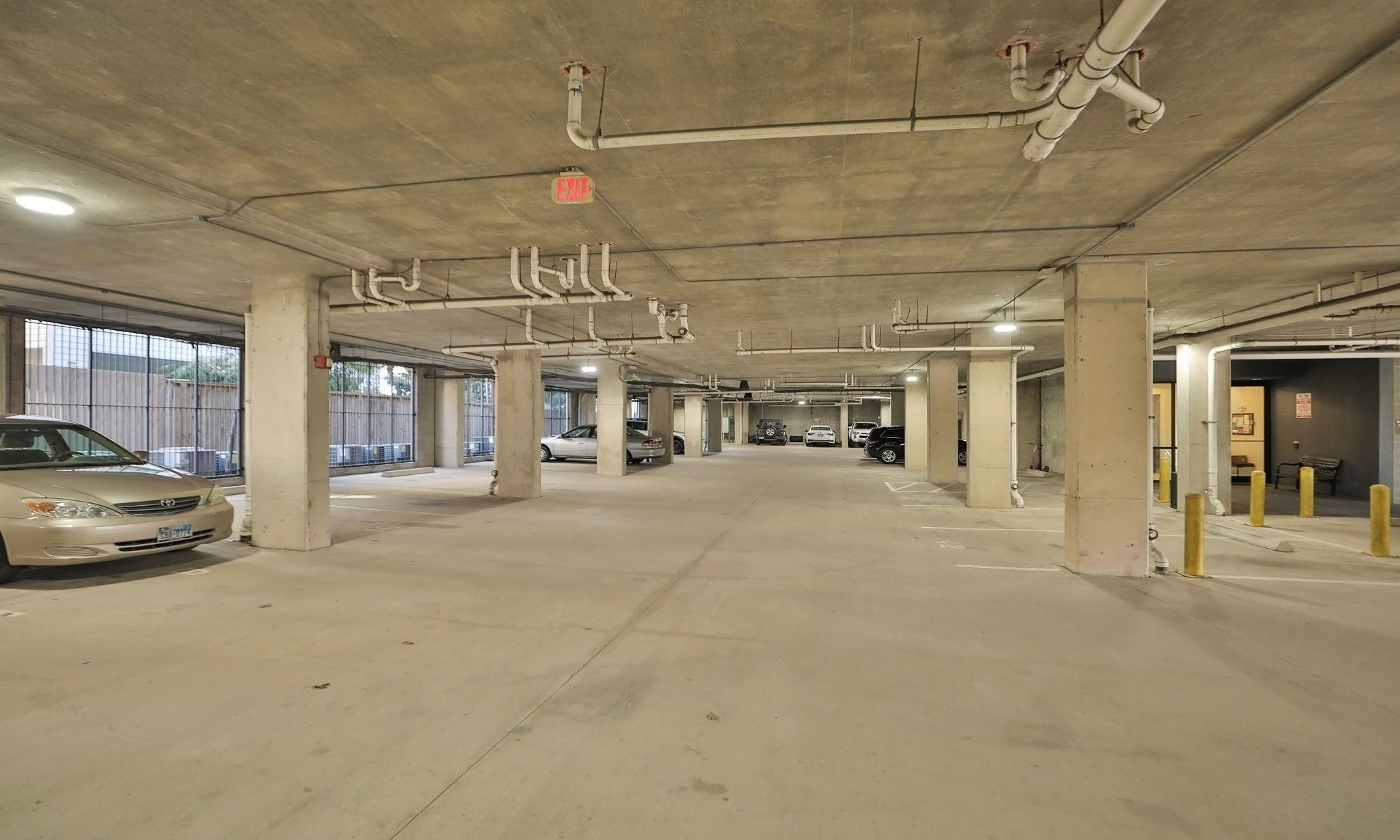 2120 Kipling Street, Unit 301 Houston, TX 77098 - Photo 5 of 39 Assigned covered parking #46 near building entrance with building access.