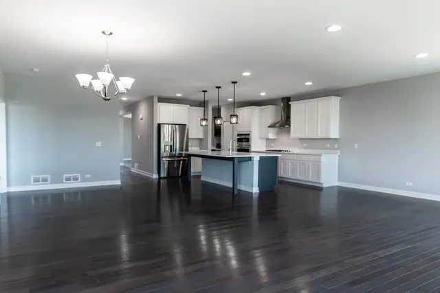 a view of a kitchen with marble kitchen and kitchen island