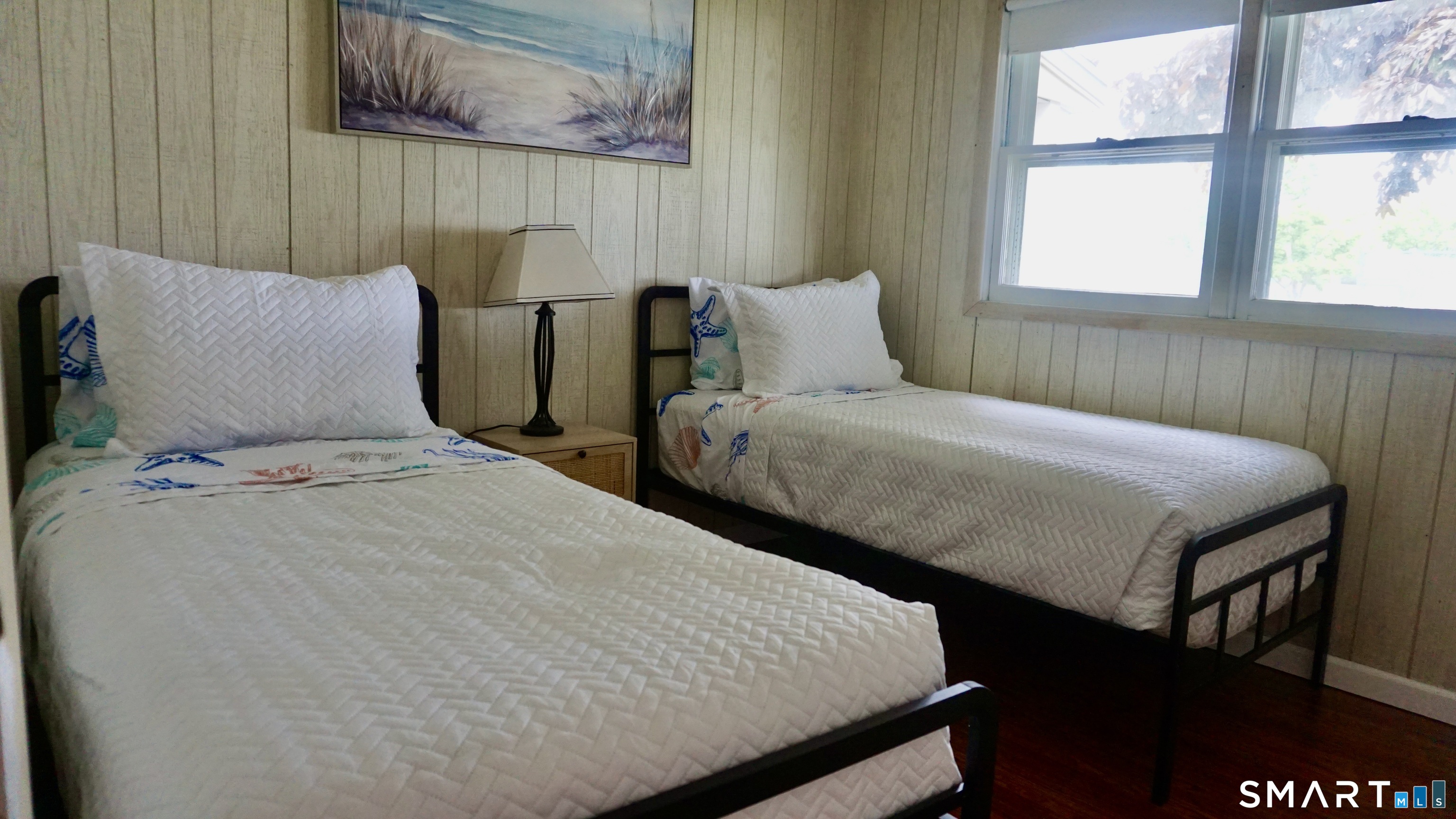 13 Pacific Street Groton, CT 06340 - Photo 24 of 31 a bedroom with two beds and a large window