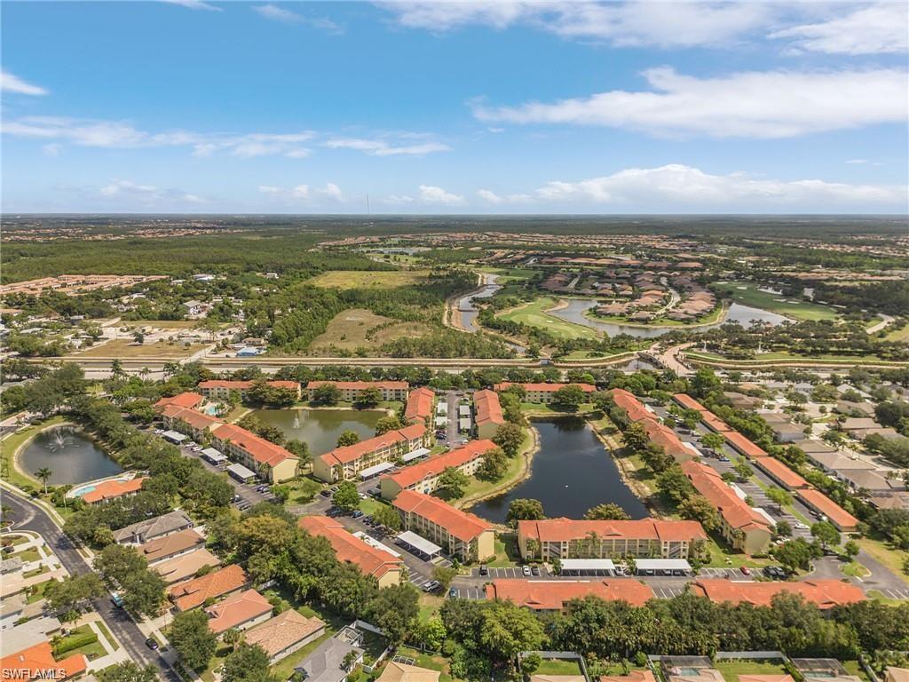 an aerial view of residential building with ocean view