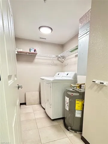 a utility room with washer and dryer