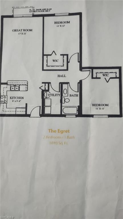 8284 Key Royal Circle, Unit 1323 Naples, FL 34119 - Photo 14 of 16 a view of a wooden floor