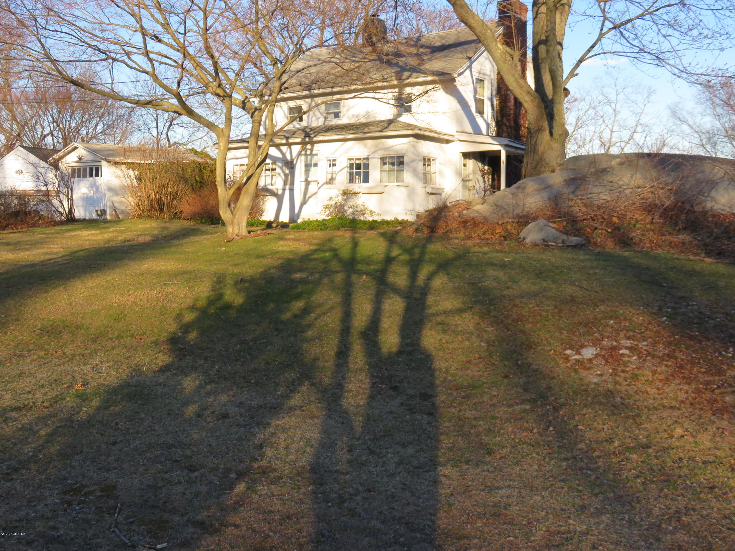 51 Sheep Hill Road Riverside, CT 06878 - Photo 5 of 5 a view of a yard in front of house