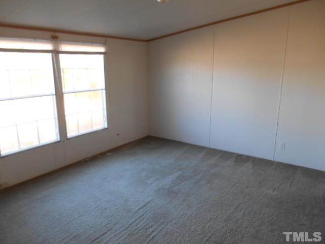 2329 Ward Store Road Fairmont, NC 28340 - Photo 11 of 12 an empty room with a window