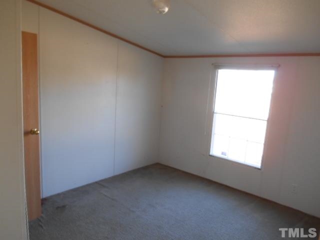 2329 Ward Store Road Fairmont, NC 28340 - Photo 9 of 12 an empty room with a window