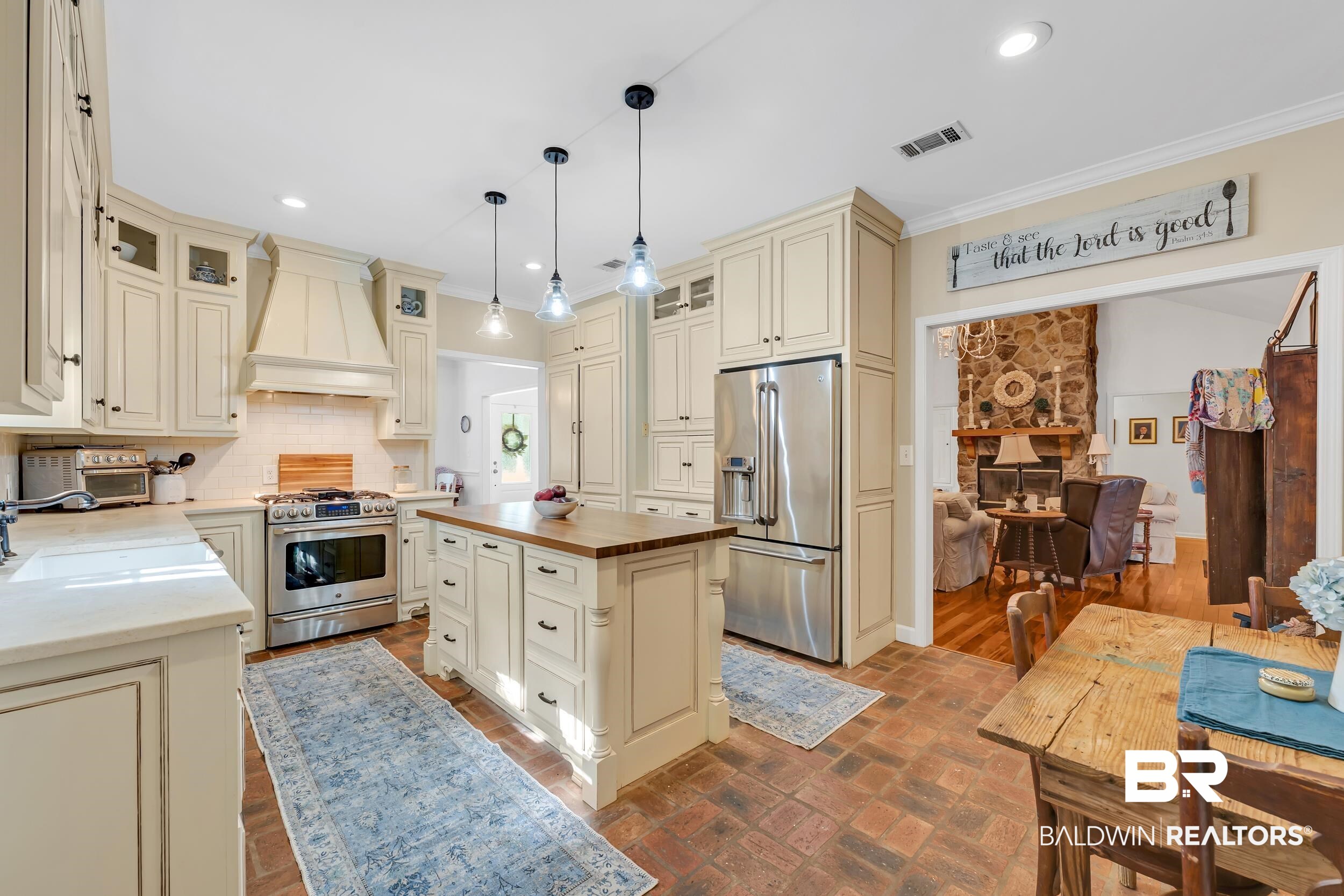 2 Navy Lane Daphne, AL 36527 - Photo 8 of 28 Kitchen with wooden counters, appliances with stainless steel finishes, cream cabinets, backsplash, and custom range hood