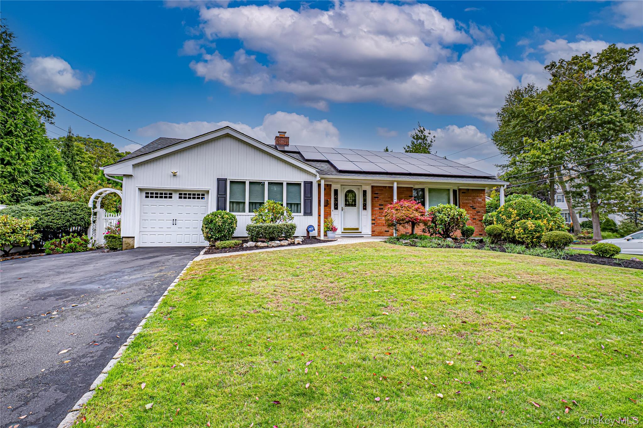 48 Archie Place West Islip, NY 11795 - Photo 1 of 1 a front view of a house with garden
