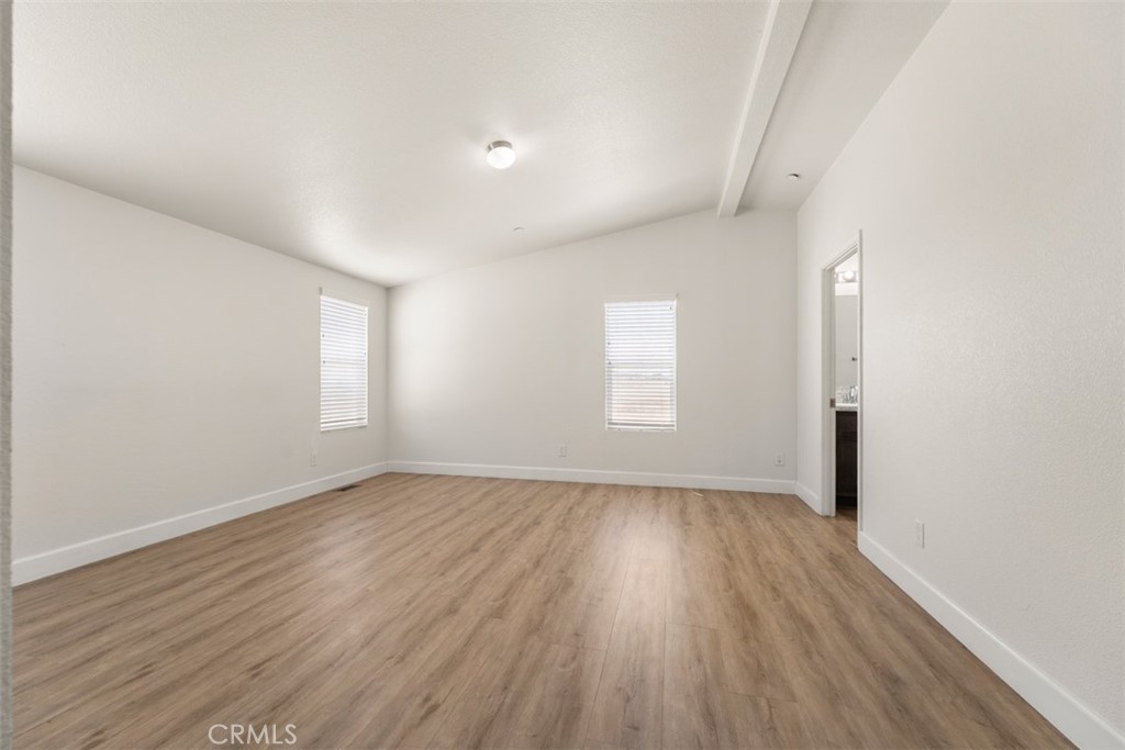 56040 Pena Road Anza, CA 92539 - Photo 21 of 42 an empty room with wooden floor and windows