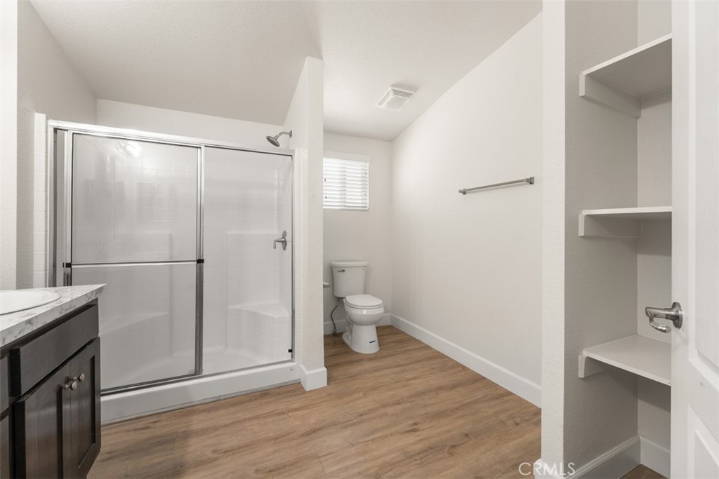 56040 Pena Road Anza, CA 92539 - Photo 25 of 42 a bathroom with a shower and a toilet