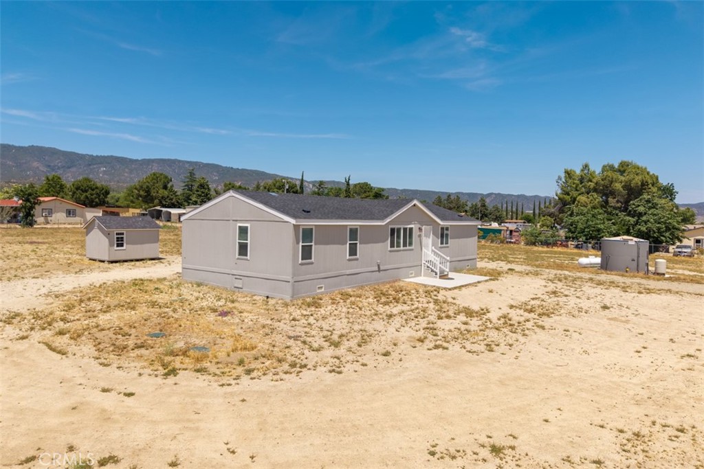 56040 Pena Road Anza, CA 92539 - Photo 28 of 42 a view of a house with a yard