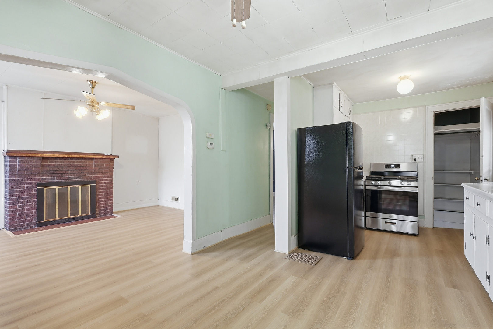 2748 12th Avenue Moline, IL 61265 - Photo 17 of 35 a kitchen with stainless steel appliances a refrigerator and a fireplace