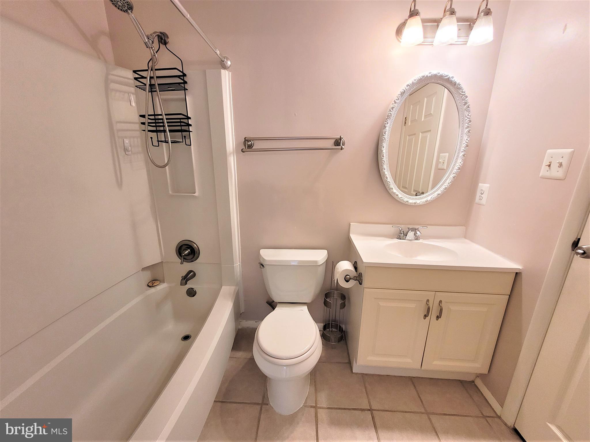 8072 Grandview Court Springfield, VA 22153 - Photo 18 of 32 a bathroom with a sink toilet and shower