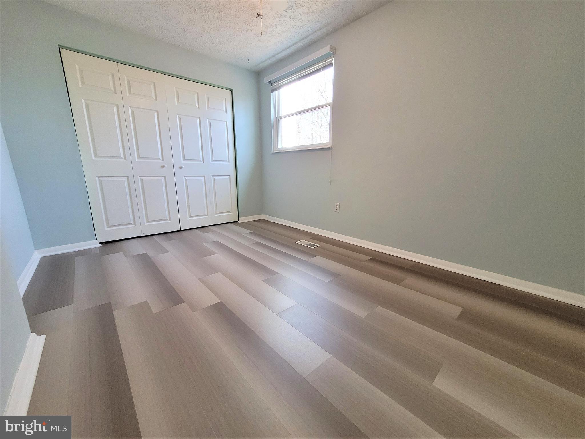 8072 Grandview Court Springfield, VA 22153 - Photo 19 of 32 a view of an empty room with closet