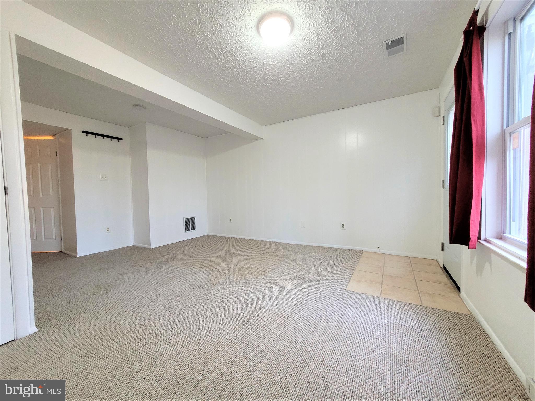 8072 Grandview Court Springfield, VA 22153 - Photo 23 of 32 an empty room with a projector and a window