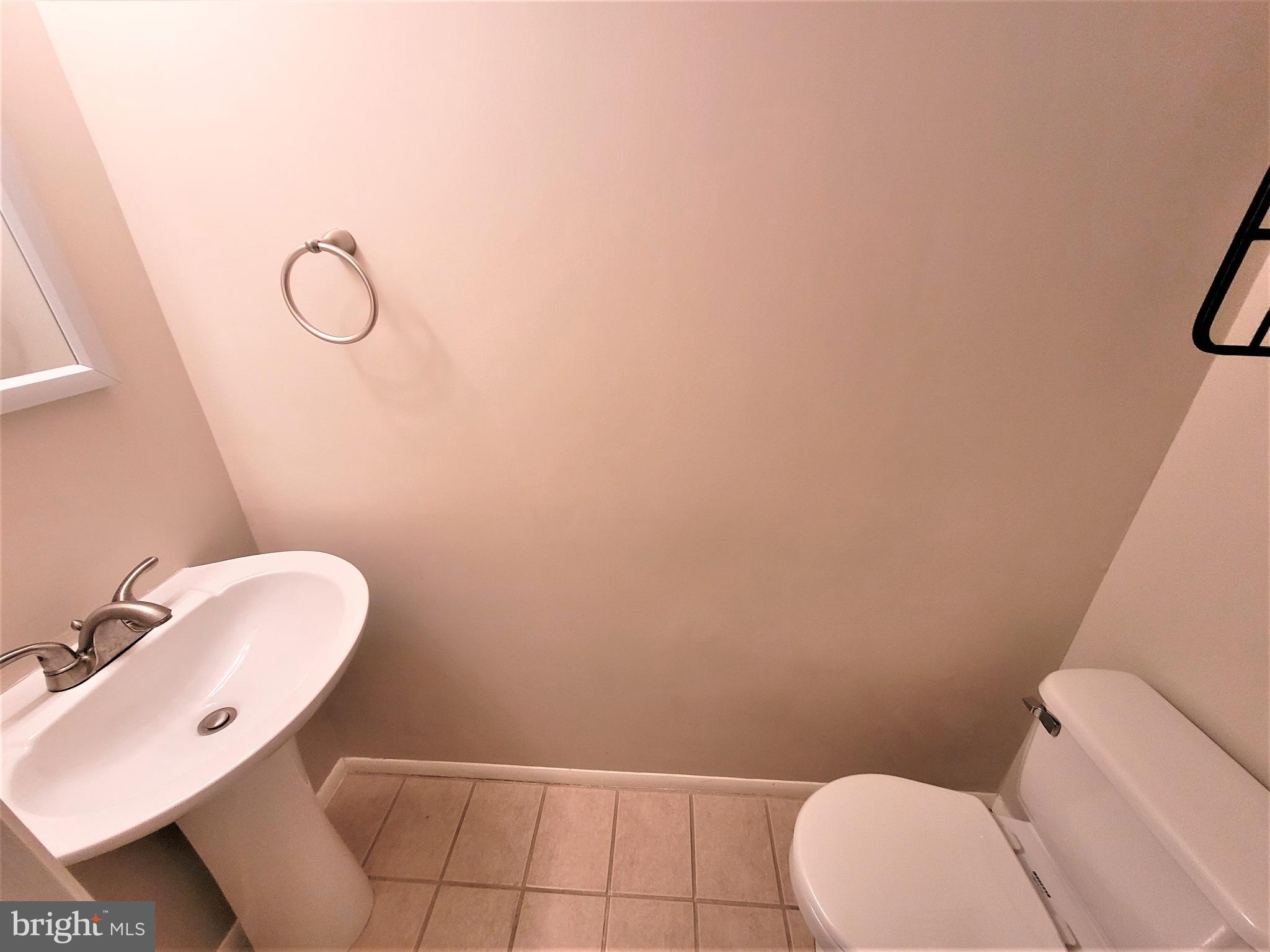 8072 Grandview Court Springfield, VA 22153 - Photo 24 of 32 a bathroom with a toilet and a sink